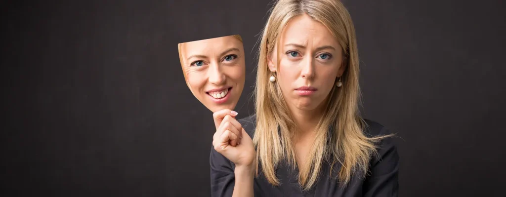 woman showing body sensations and emotions using a mask